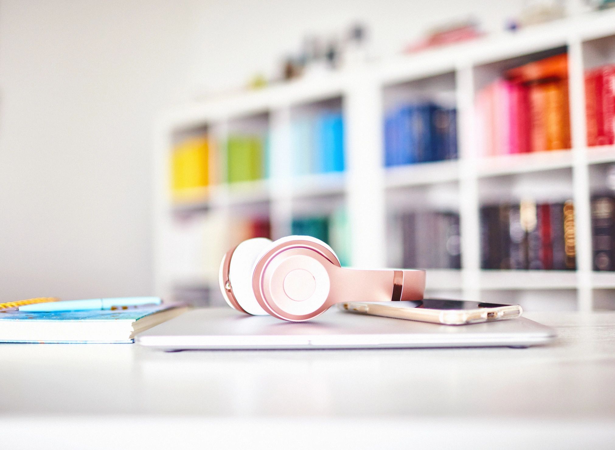 Headphones and laptop on a clean desk