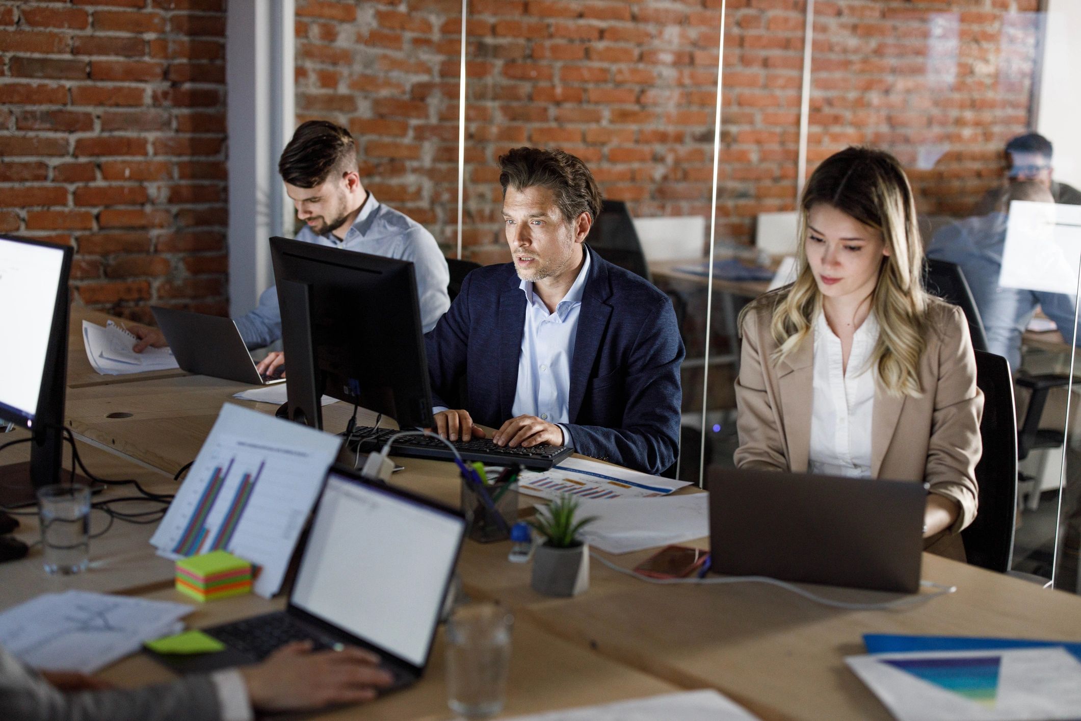 Entrepreneurs working at computers in an office