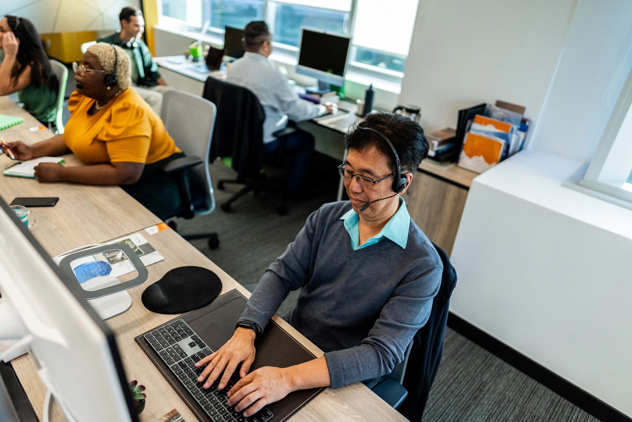 Support representative working at a computer