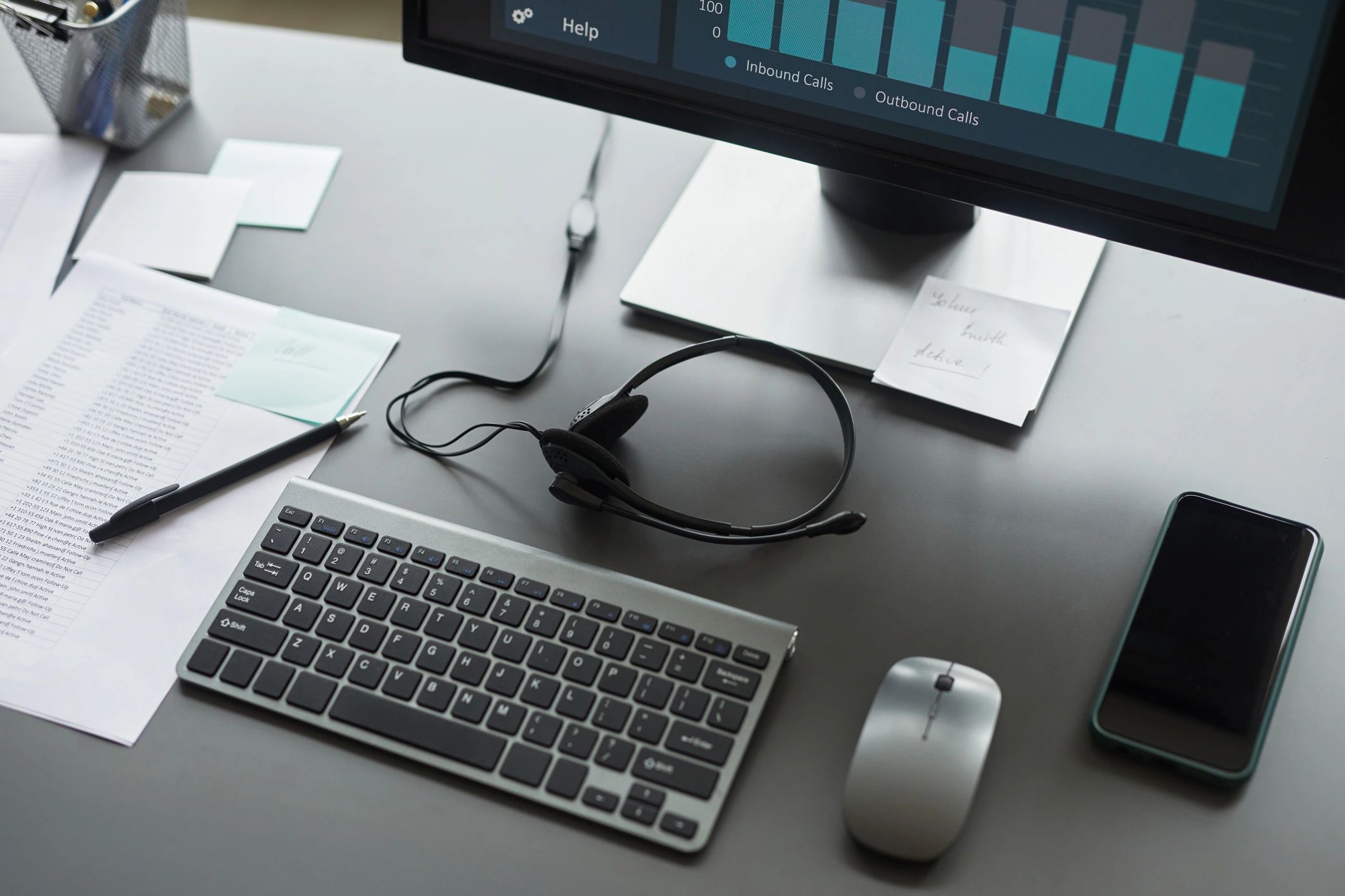 Office desk with headset and peripherals